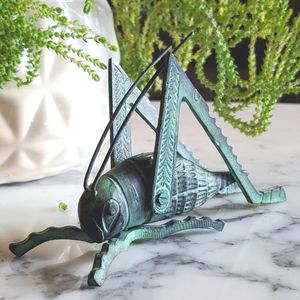 Metal grasshopper figure